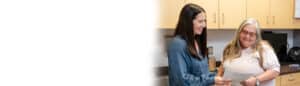 Blurred consultation photo – Two female staff or patients in mid-conversation