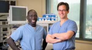 Surgical staff in scrubs – Two Alpine Surgical professionals standing inside sterile prep room