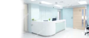 Medical reception area – White, modern clinic front desk with clean minimalist design