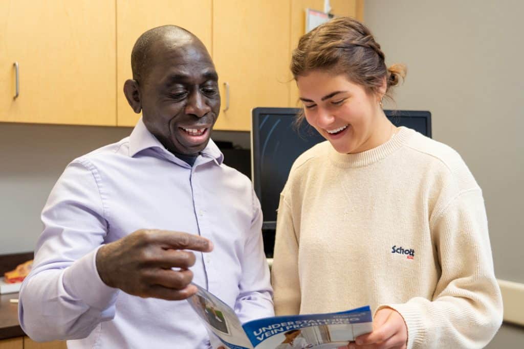 Dr. Akin Beckely with a patient in Alpine Surgical in Boulder, CO