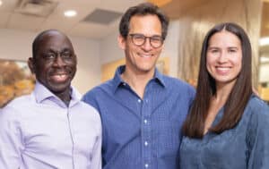 Experienced oral surgeons near Boulder, CO – Group photo of Alpine Surgical team including male surgeon with glasses