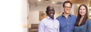 Alpine Surgical team in Boulder, CO – Male oral surgeons smiling inside clinic setting