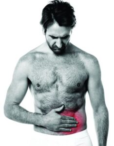 Patient with abdominal pain – Man touching lower right abdomen indicating potential GI distress or appendix issue