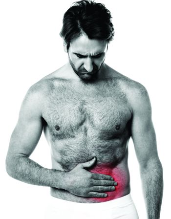 Man holding his stomach - suffering from hernia