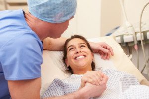 Young girl hugging a doctor after successful surgery, symbolizing recovery and care